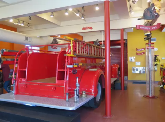 Attractive children's museum with market and carts, Newton's playhouse where you can shoot balls, ball pit, fire engine, oak tree tunnels, stage, dress-up area, and pizza kitchen.