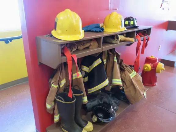 Attractive children's museum with market and carts, Newton's playhouse where you can shoot balls, ball pit, fire engine, oak tree tunnels, stage, dress-up area, and pizza kitchen.
