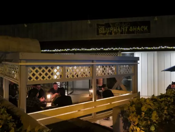 The Elephant Shack has cute outdoor seating with lanterns.
