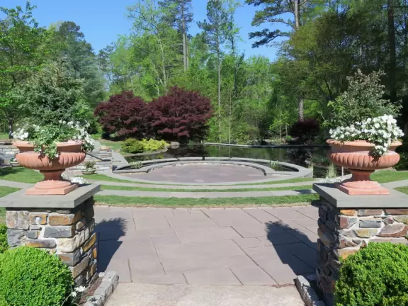Large world-class garden with lakeside allees, flower terraces, and small Japanese garden.