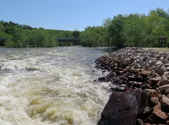 Watch water come rushing out of a dam, and then&nbsp; picnic on the grass or fish at the lake.