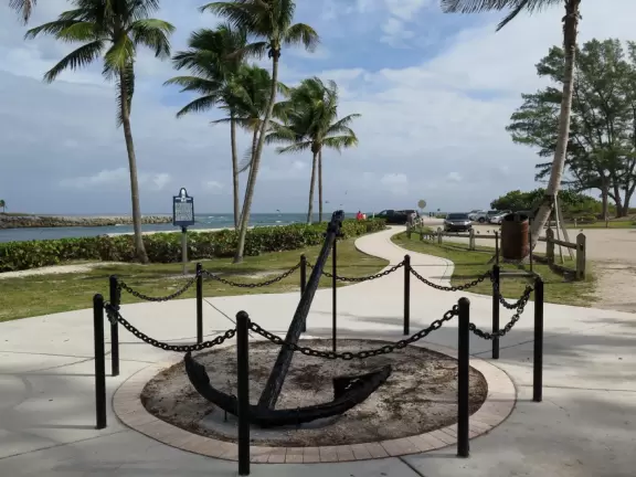 Large lagoon with clear water where kids can swim, tons of shade, and playground in the sand.
