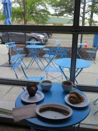 Guglhupf pastries at Cocoa Cinnamon Lakewood, and blue outdoor seating.
