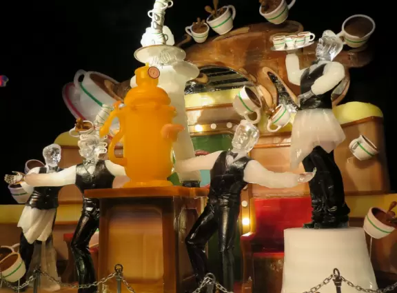 Hotel inside a giant atrium with tropical plants, fish, alligators, and decorations. ICE sculpture event in December.