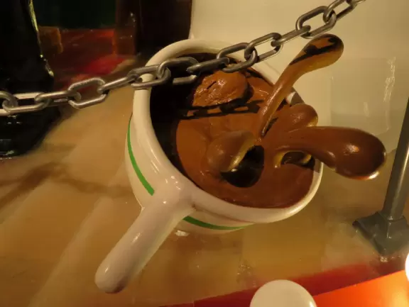 Hotel inside a giant atrium with tropical plants, fish, alligators, and decorations. ICE sculpture event in December.