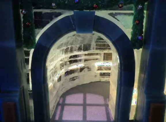 Hotel inside a giant atrium with tropical plants, fish, alligators, and decorations. ICE sculpture event in December.