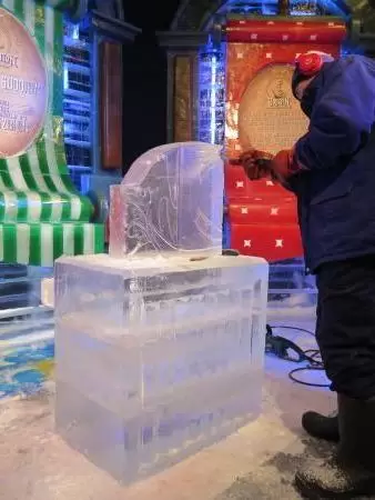 Hotel inside a giant atrium with tropical plants, fish, alligators, and decorations. ICE sculpture event in December.