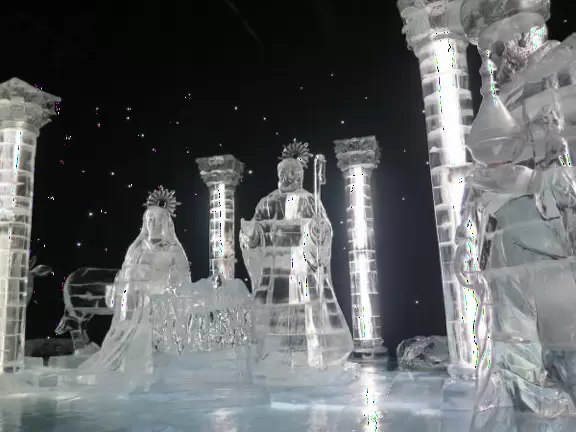 Hotel inside a giant atrium with tropical plants, fish, alligators, and decorations. ICE sculpture event in December.