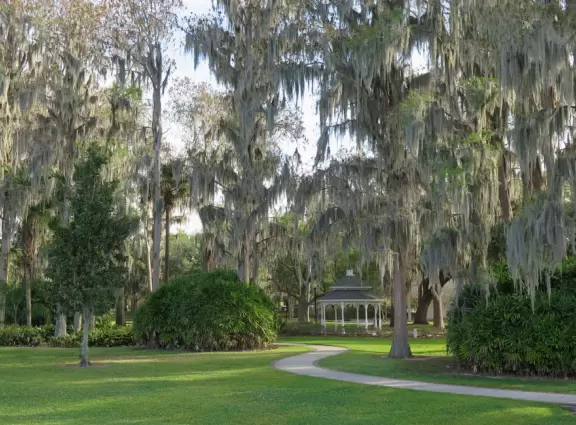 Beautiful park with lake, incredible cypress trees, playground, gazebos, winding trails, and 1920s mansion.