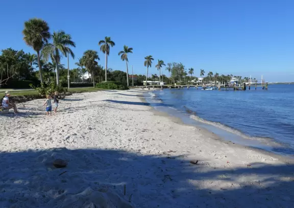 Fine white sand, afternoon shade, lapping waves, snowy egret, and lots of things for kids to play with.