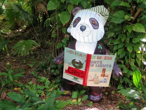 Lush paradise with water lilies galore, rustling bamboo, stone bridge, tropical flowers, strangler fig, and a gorgeous royal palm grove.