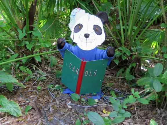 Lush paradise with water lilies galore, rustling bamboo, stone bridge, tropical flowers, strangler fig, and a gorgeous royal palm grove.