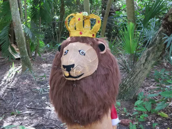 Lush paradise with water lilies galore, rustling bamboo, stone bridge, tropical flowers, strangler fig, and a gorgeous royal palm grove.