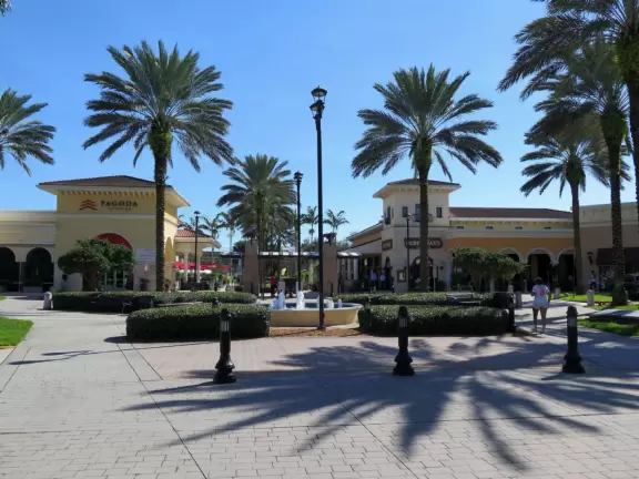 Outdoor mall with movie theater, cafes with atmosphere, candy shop, and more.