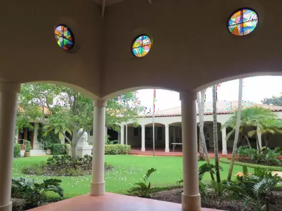 A peaceful garden, open in the mornings, with statues where you can light a candle.