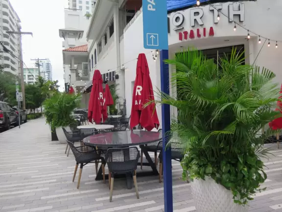 Outdoor mall in downtown Miami's city streets, with colorful decorations.
