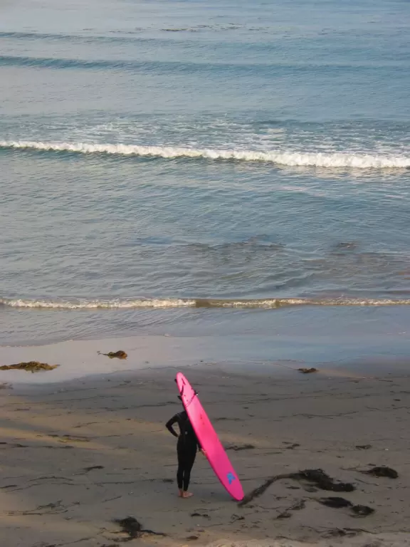 Surfer girl at Sands Beach.