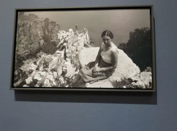 Jetta, Escher's wife, on the Amalfi Coast, with view of Atrani, 1931. 