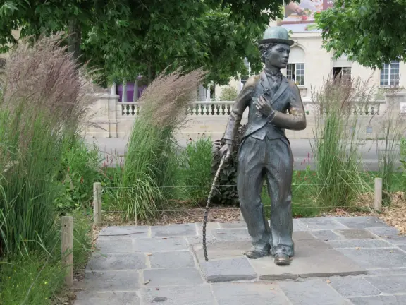 Beautiful waterfront walking path with flower beds, giant fork sculpture on the water, food museum with interesting garden, and square with historic buildings and cafes.