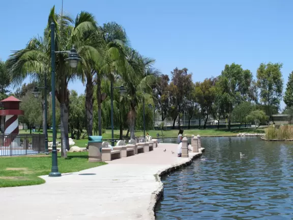 A huge beautiful park with lake, turtle and frog sculptures, lighthouse, boat to climb in, splash pad, workout equipment- you name it they have it! Four play areas!