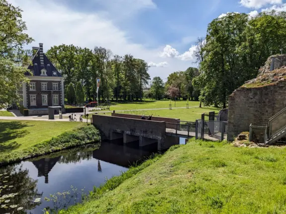 A small fortified castle or mansion, in a huge park with playground, gnome houses, and petting zoo.