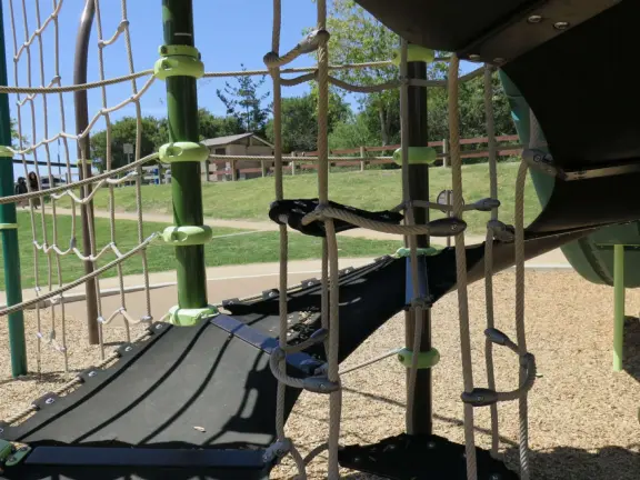Incredible playground in a warm valley, with a pretty trail to walk.