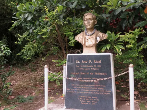 A gorgeous public garden under high mountain ridges, with dwellings representing the many cultures that are found in Maui: Portuguese, Chinese, Japanese, Filipino, Hawaiian, and New England.