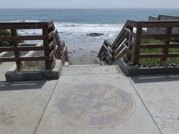 Compass and the stairs to the sand. 
