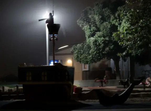 Pirate with telescope on the playground, at night in the fog!