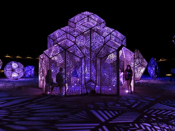 A wonderful exhibit on acres of undulating hills, with a field of lights resembling a flower field, and metal sculptures making patterns of light.