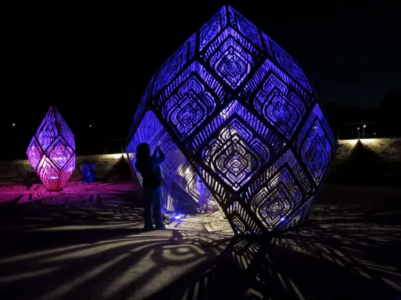 A wonderful exhibit on acres of undulating hills, with a field of lights resembling a flower field, and metal sculptures making patterns of light.