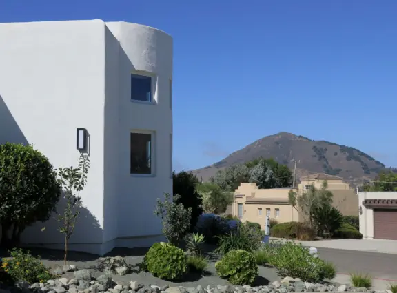 Hilltop park with basketball court with views, picnic tables, eucalyptus trees, and a difficult two-mile out-and-back trail.