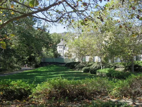 Wide partially shady path that leads through oak forest, past a market, and a Secret Garden with live music, to Avila Beach.