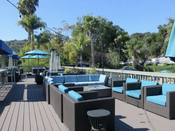 Wide partially shady path that leads through oak forest, past a market, and a Secret Garden with live music, to Avila Beach.