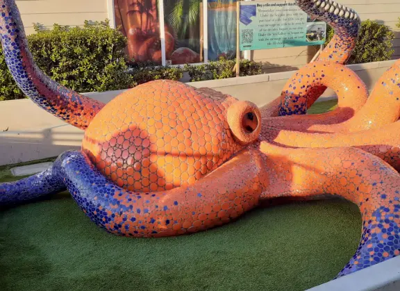 Lovely walkway on the water in front of the cafes in Morro Bay! Mosaic tile sculptures play area for kids.