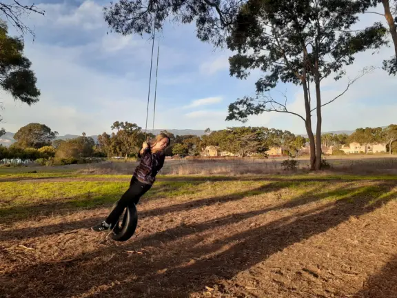 Swinging on the tire swing.