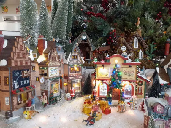 Festive beach with white cliffs, popular playground, pier, and cafe coming soon.