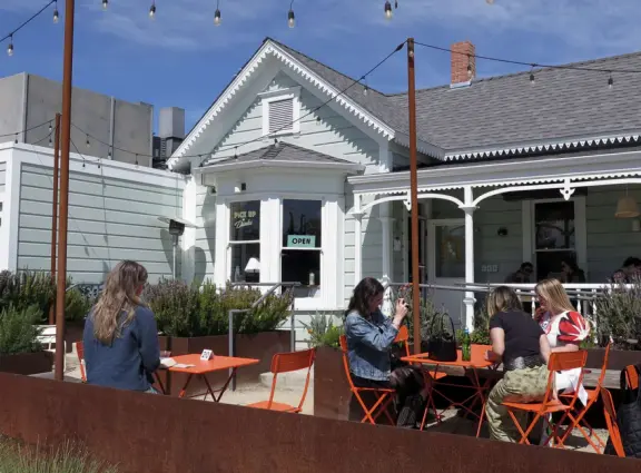 Attractive public market two minutes drive north of downtown, with outdoor and indoor seating, and nice walks nearby.