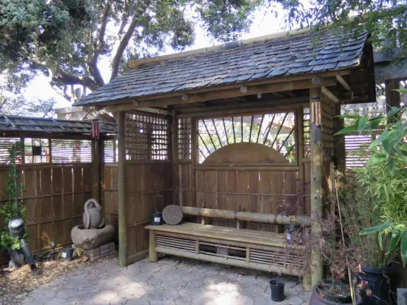 Garden in a sunny, sheltered spot, with cottage with turret under redwood trees, Buddhist gazebo, goats, and flowers galore! Seasonal pumpkins and Christmas market!