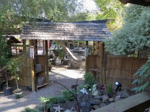 Garden in a sunny, sheltered spot, with cottage with turret under redwood trees, Buddhist gazebo, goats, and flowers galore! Seasonal pumpkins and Christmas market!