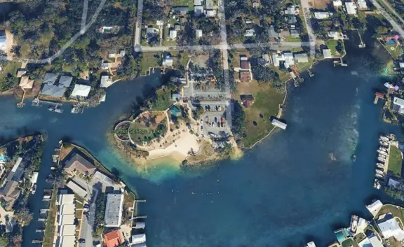 White sand beach on the canals of Crystal River, with a roped swimming section that is wonderful for a dip!