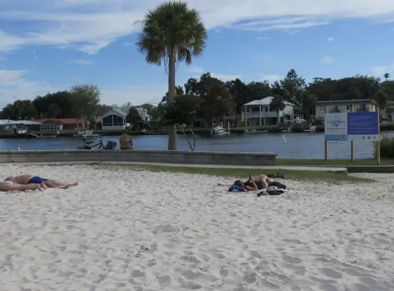 White sand beach on the canals of Crystal River, with a roped swimming section that is wonderful for a dip!