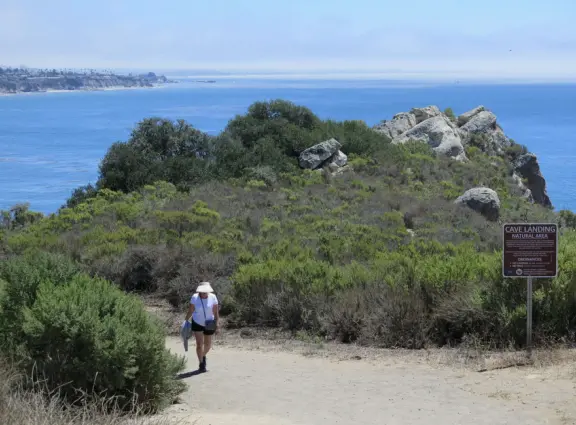 Warm, sheltered cove below Smuggler's Cave. Steep climb down.