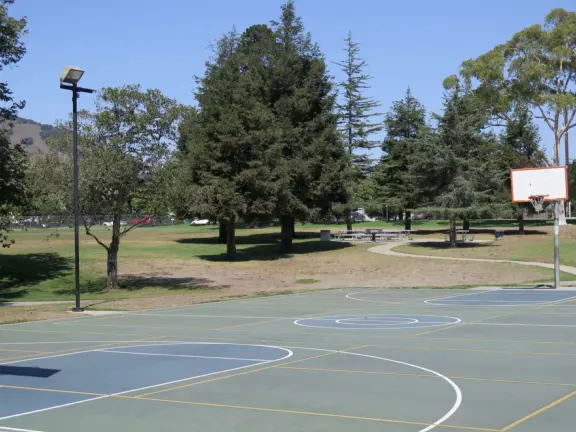A lush park with rolling hills to run on, one-mile loop walking path, and basketball and sand volleyball courts. Currently has a crime problem.