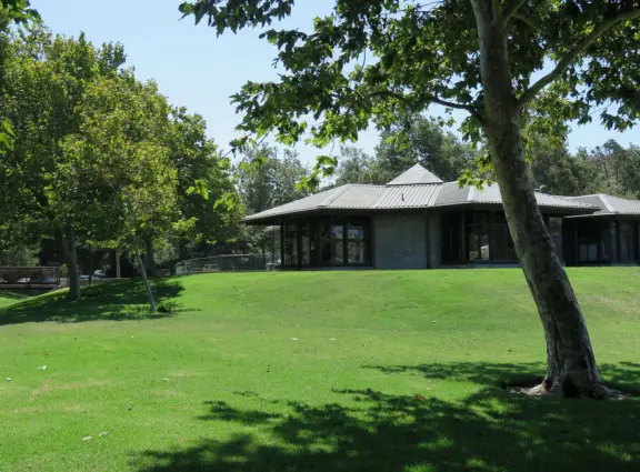 A lush park with rolling hills to run on, one-mile loop walking path, and basketball and sand volleyball courts. Currently has a crime problem.