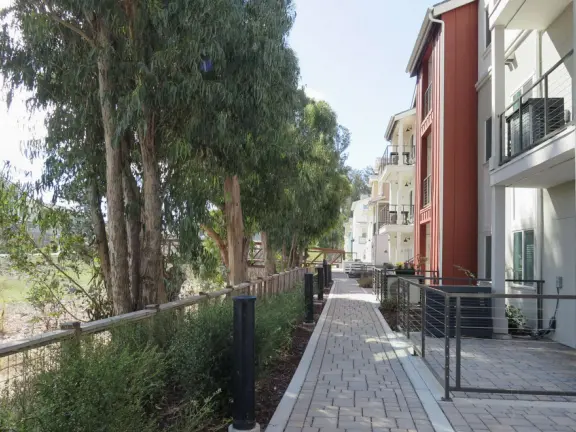 Lovely path beside a eucalyptus forest, on both sides of the creek, with workout stations, in a residential neighborhood. You can walk two miles total. Also called San Luis Ranch.