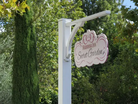 Walk the secret garden, plus admire the ranunculus flowers at the Madonna Inn entrance door in springtime, or swing, line, and ballroom dance on the fancy dance floor to live music most nights!