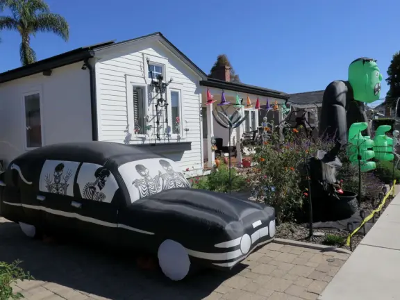 Large lush park with tall tropical trees, attractive bandstand, cute toddler playground, historic house and schoolhouse, swinging bridge to the main street, and neighborhood with cottages.