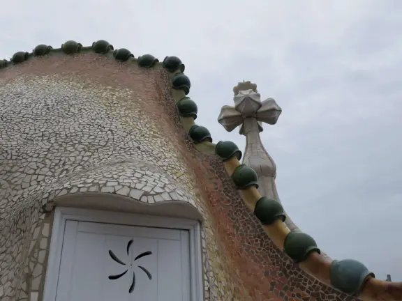 Rooftop, like the scales on a dragon's back, and bulbous cross, like Saint George's lance. 