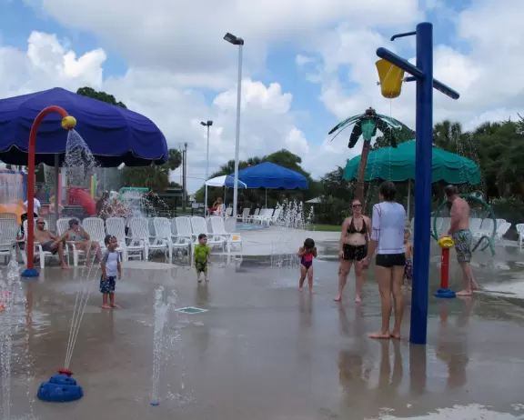 Fun splash playground and splash pad with plenty of shaded chairs for parents.